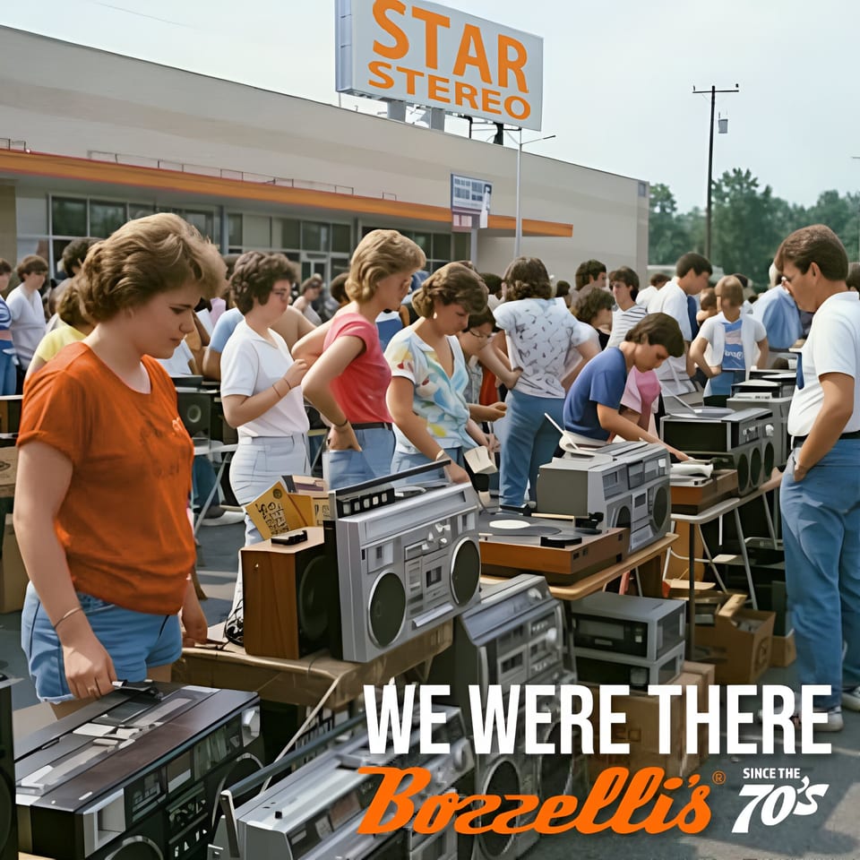 A 70s outdoor electronics sale with people browsing boomboxes and stereos under a "Star Stereo" sign.